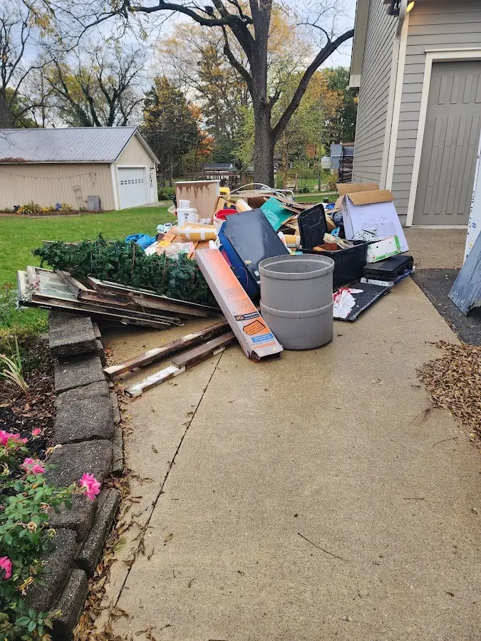 Dumpster being loaded with debris for Estate Cleanout Dumpster Rental in Oley